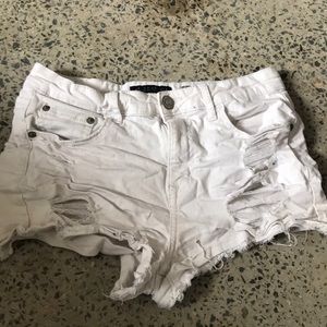White ripped jean shorts